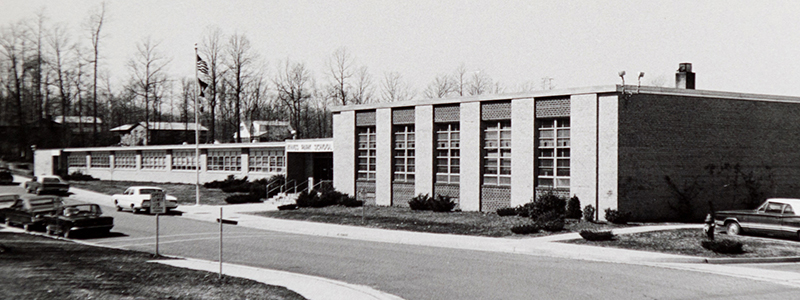 Black and white photograph of the front entrance of Kings Park Elementary School, circa 1968.